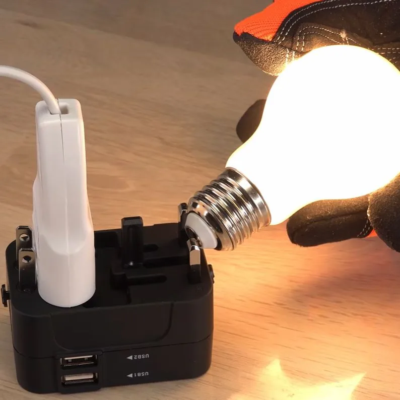 Prueba con ampolleta sobre las clavijas del adaptador de viaje