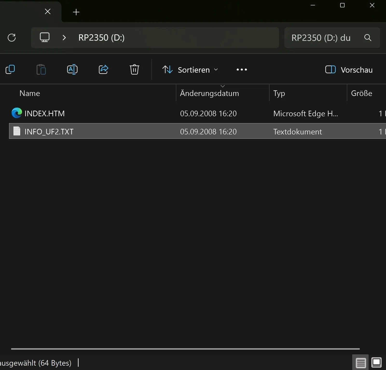 Explorador de Windows mostrando la unidad RP2350 del Pico 2 W en modo BOOTSEL, con los archivos INDEX.HTM e INFO_UF2.TXT