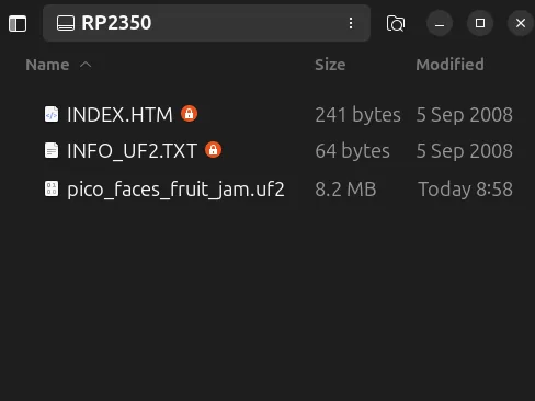 Unidad RP2350 con el archivo pico_faces_fruit_jam.uf2 ya copiado